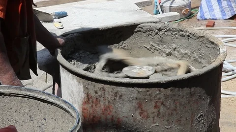 Mixing the cement in the tank Stock Footage