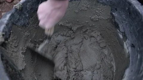 Mixing cement with a trowel Stock Footage 60443086