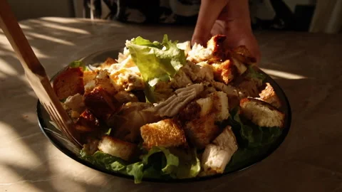 Mixing cezar salad with fork Stock Footage 155080239