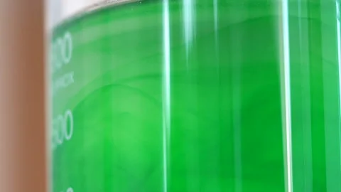 Mixing chemicals in laboratory, testing and dripping test fluid in close up, Stock Footage 147994722
