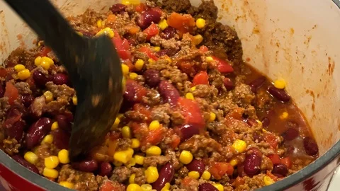 Mixing Chili during Cooking Stock Footage 122646835