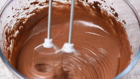 Mixing chocolate cake dough or batter Stock Footage 103662160