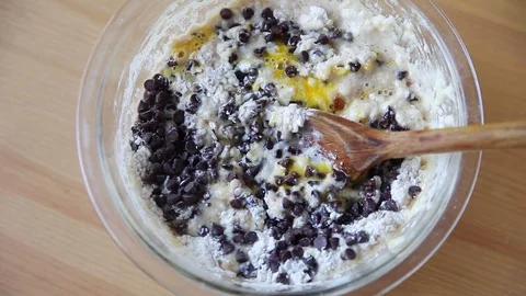 Mixing chocolate chips into cake batter Stock Footage 75420791