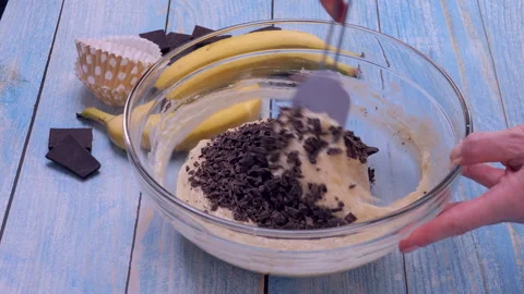 Mixing Chocolate Chunks into Dough Stock Footage 322926770