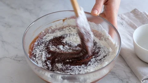Mixing chocolate dough or batter for baking cakes, cookies, pastry. Mixer Stock Footage 121109832