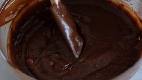 Mixing chocolate dough or batter for baking cakes, cookies, pastry. Mixer Stock Footage 121109838
