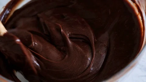 Mixing chocolate dough or batter for baking cakes, cookies, pastry. Mixer Stock Footage 121110075