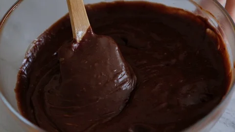 Mixing chocolate dough or batter for baking cakes, cookies, pastry. Mixer Stock Footage 121110114