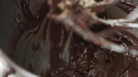 Mixing chocolate with a plastic spatula Stock Footage 132787290