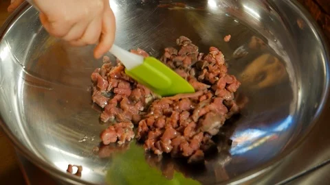 The mixing chopped meat in a dish Stock Footage 91549037