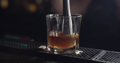 Mixing a cocktail at the bar Stock Footage 137823173