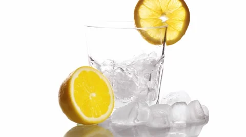 Mixing  Cocktail In A Glass Adding Ice Tonic Water And Slice Of Lime Stock Footage 65113903
