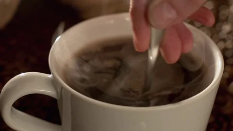 Mixing coffee in slow motion Stock Footage