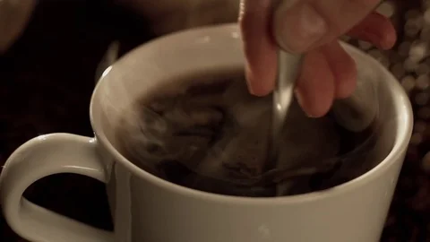 Mixing coffee in slow motion Stock Footage 76051977