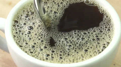 Mixing coffee with spoon, slow motion Vídeos de archivo 67903393