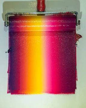 Mixing colors using a roller to roll over the ink. Stock Photos
