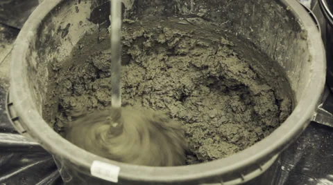 Mixing concrete in the bucket Stock Footage 35572756