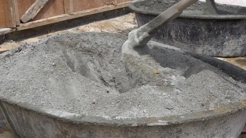 Mixing Concrete with Hoe Stock Footage