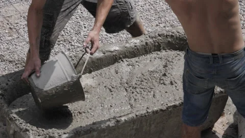 Mixing Concrete Manually At The Construction Site Stock Footage 327985628