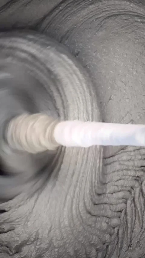 Mixing of concrete mortar. Preparation of construction mixture with a mixer Stock Footage 259229459