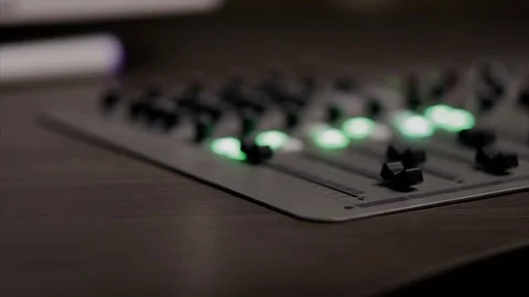 Mixing console also called audio mixer, sound board, mixing deck or mixer is an Stock Footage 72529479