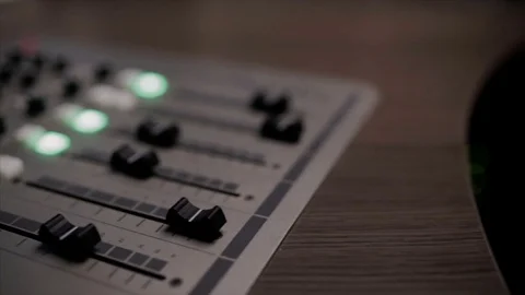 Mixing console also called audio mixer, sound board, mixing deck or mixer is an Stock Footage 72529505