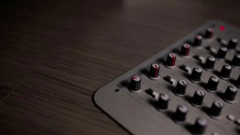 Mixing console also called audio mixer, sound board, mixing deck or mixer is an Stock Footage 72529509