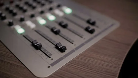 Mixing console also called audio mixer, sound board, mixing deck or mixer is an Stock Footage 72529534