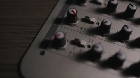 Mixing console also called audio mixer, sound board, mixing deck or mixer is an Stock Footage 72529598
