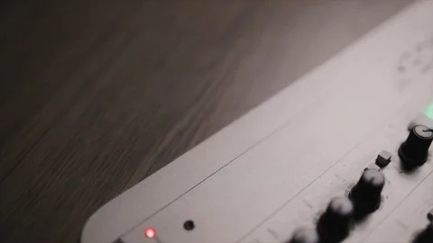 Mixing console also called audio mixer, sound board, mixing deck or mixer is an Stock Footage 72529639