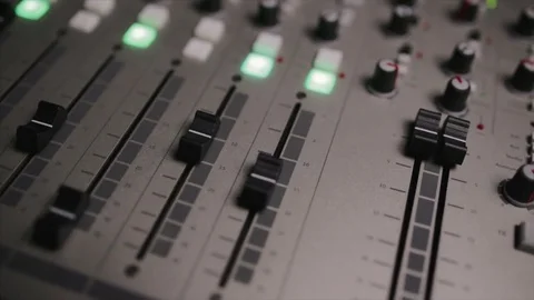 Mixing console also called audio mixer, sound board, mixing deck or mixer is an Stock Footage 72529753
