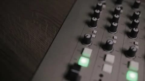 Mixing console also called audio mixer, sound board, mixing deck or mixer is an Stock Footage 72529775