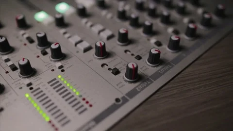 Mixing console also called audio mixer, sound board, mixing deck or mixer is an Stock Footage 72529801