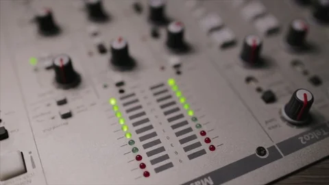 Mixing console also called audio mixer, sound board, mixing deck or mixer is an Stock Footage 72529884