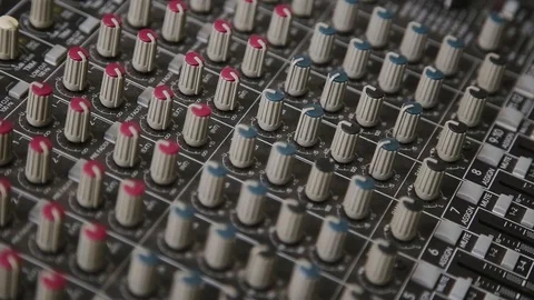 Mixing console also called audio mixer, sound board, mixing deck or mixer is an Stock Footage 93160006