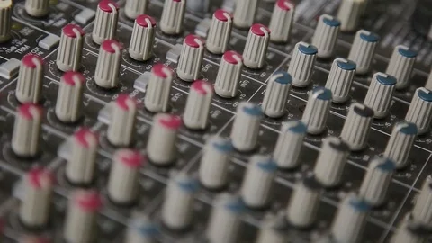 Mixing console also called audio mixer, sound board, mixing deck or mixer is an Stock Footage 93160121