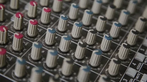 Mixing console also called audio mixer, sound board, mixing deck or mixer is an Stock Footage 93160280