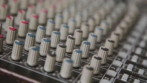 Mixing console also called audio mixer, sound board, mixing deck or mixer is an Stock Footage 93160456