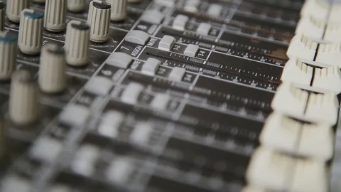 Mixing console also called audio mixer, sound board, mixing deck or mixer is an Stock Footage 93160643