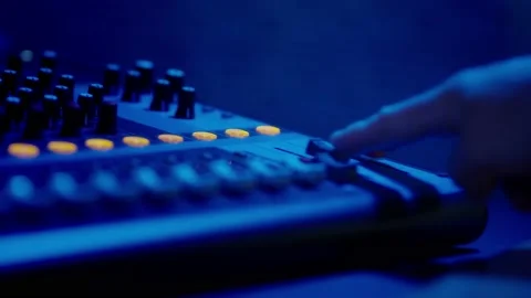 Mixing Console Faders in Use at a Professional Recording Studio Stock Footage