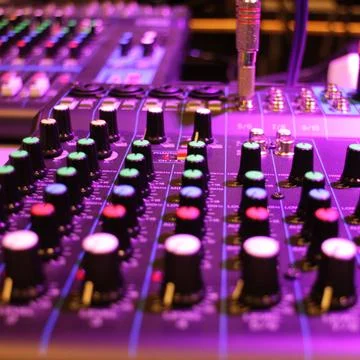 Mixing console at the recording studio. Audio mixer buttons, knobs and faders Foto stock