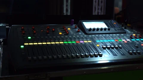 Mixing console on which the colored buttons are lit, shooting in a nightclub 스톡 동영상 106560190