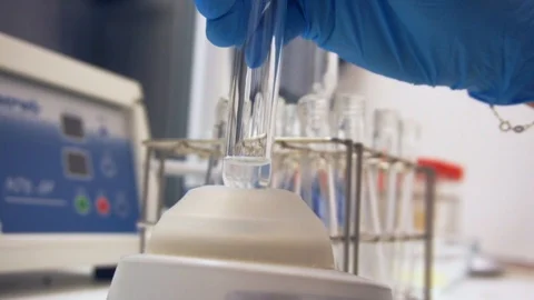 Mixing content of test tube Stock Footage 87804877