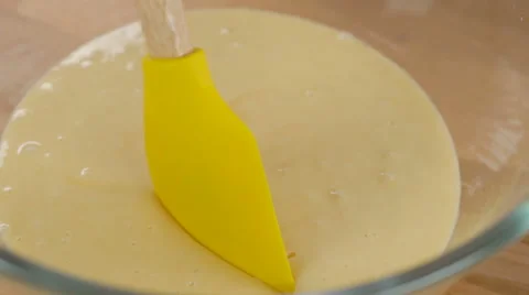 Mixing cream and egg for cooking dessert Stock Footage 66991443