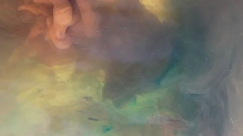 Mixing Creative Liquid Flows in Motion flows a bright brown and blue Stock Footage 146267697