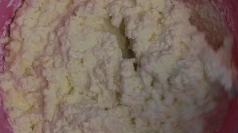 Mixing the curd mass in close-up Stock Footage 270728739
