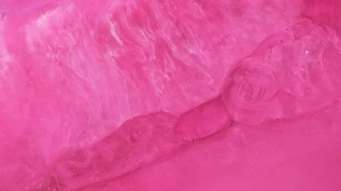 Mixing different colored alcohol inks in a close-up view Stock Footage 342157875