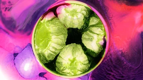 Mixing different colored alcohol inks in a close-up view Stock Footage 342356810