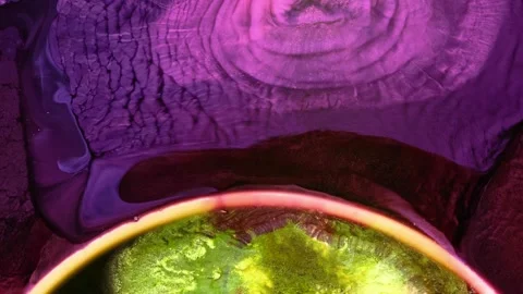 Mixing different colored alcohol inks in a close-up view Stock Footage 342356816
