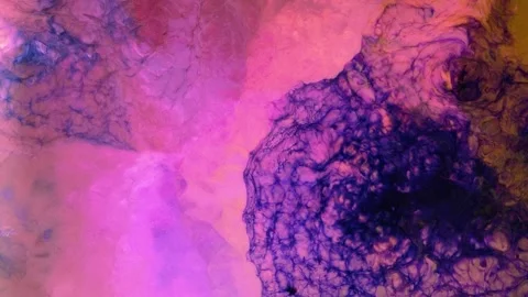 Mixing different colored alcohol inks in close-up view with vibrant patterns Stock Footage 342448110